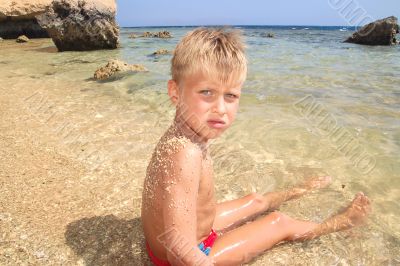  Boy playing on the beach