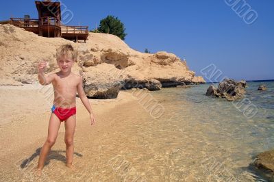  Boy playing on the beach