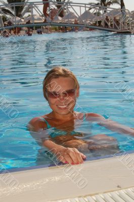 Beautiful woman in a swimming pool.