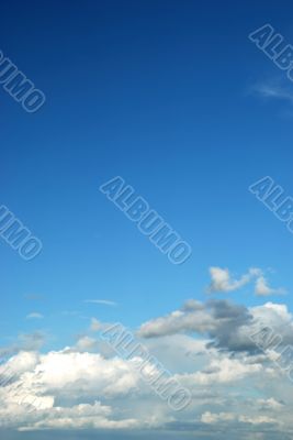 fluffy cloud on bright blue sky