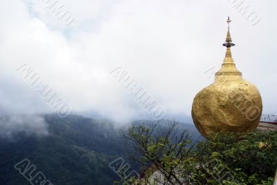 Golden rock and clouds