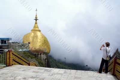 Golden rock and tourist