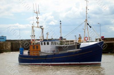 Fishing trawler in harbor