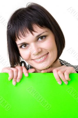 smiling woman with green billboard