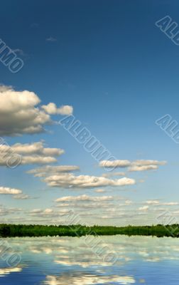 Cumulus clouds over lake