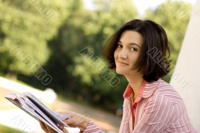 woman reading in park