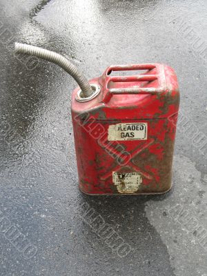 red gas can on the pavement