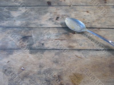 metal dirty spoon on a table
