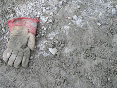 dirty glove on the ground