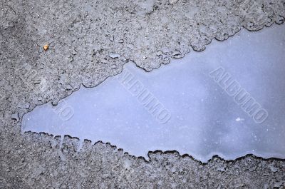 drops of rain water on a fresh asphalt