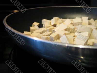 tofu cooking in a pan