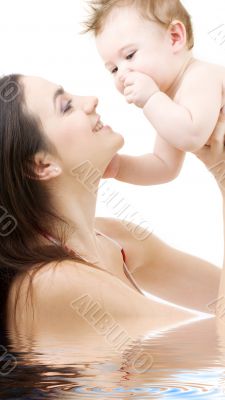 blue-eyed baby in mother hands