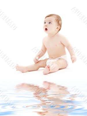 baby boy in diaper with toothbrush