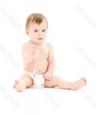 baby boy in diaper with toothbrush