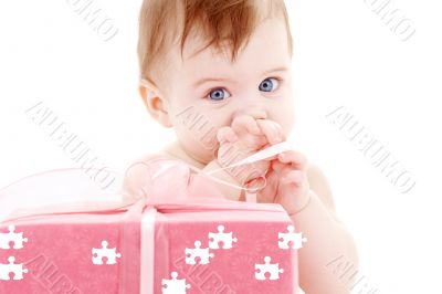 baby boy with puzzle gift box