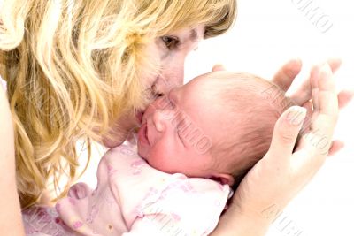 Mother kissing her child