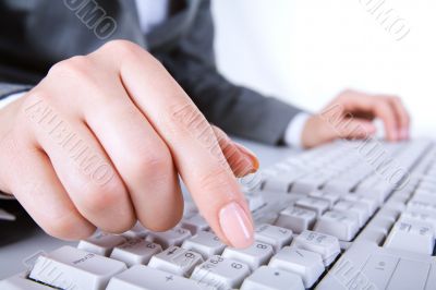 Finger over button