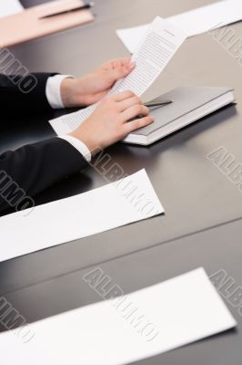 Hands with document