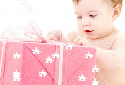 baby boy with puzzle gift box