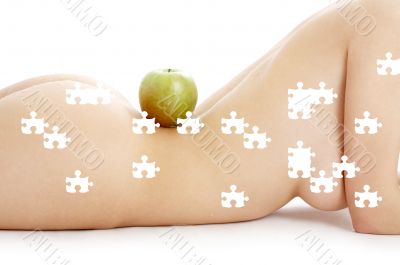 puzzle of woman torso with green apple