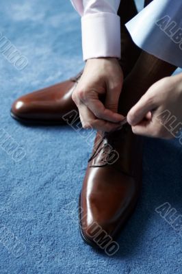 Businessman dressing for work