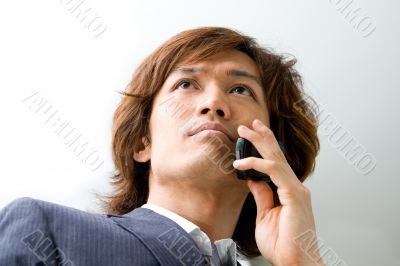 Asian business man and phone