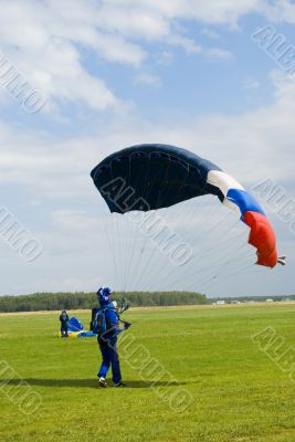 Landing of the sportsman after parachute jump