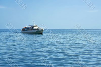 Pleasure boat at sea rolled tourists