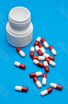 Pills over blue background
