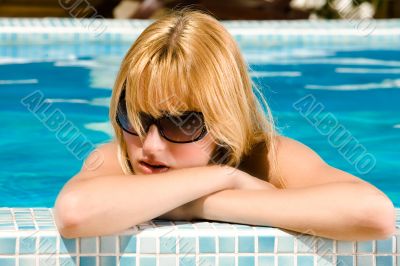 Taking a sunbath in the pool