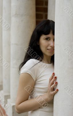 girl standing near white column
