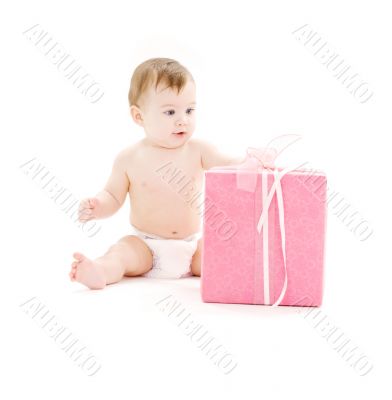 baby boy in diaper with big gift box