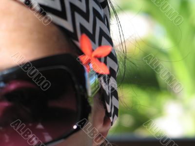 girl with sunglasses and flower