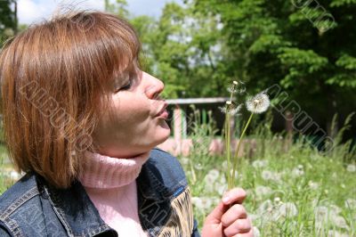 woman and dandelion