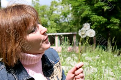 woman and dandelion