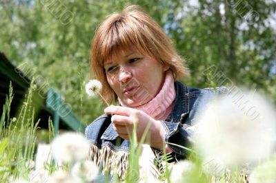 woman and dandelion