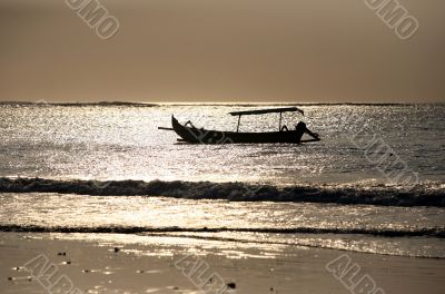 Drifting boat on a sunset