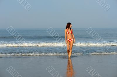 Beautiful girl on the ocean beach