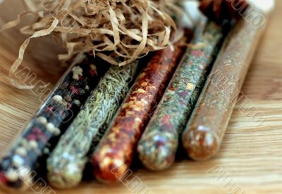 spices in a glass on wood table