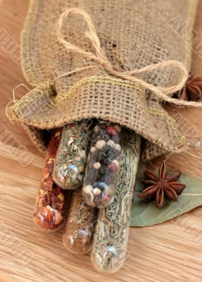 spices in a glass on wood table