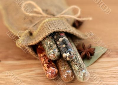 spices in a glass on wood table