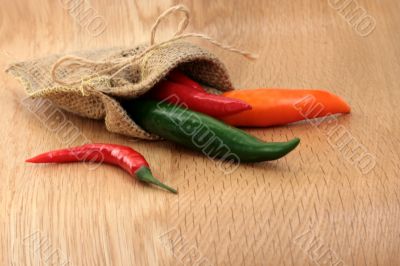 colored pepper on wood table