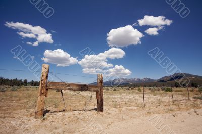 Aged Fence and Clouds