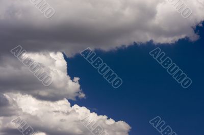 Puffy Clouds on a blue sky.