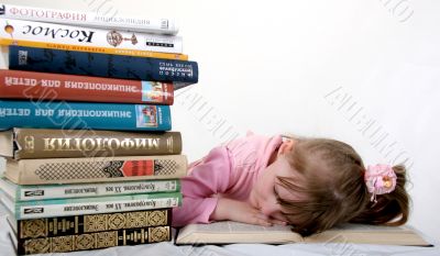 girl sleep under book