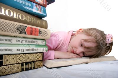 girl sleep under book