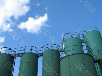 giant green containers, silos