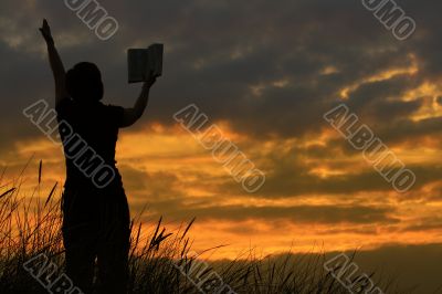 female praying with bible