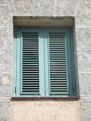 green old window on a brick building