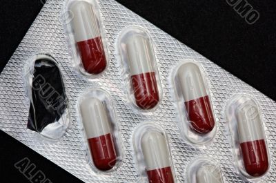 Pills in plastic container